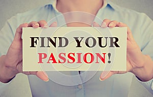 Businesswoman hands holding card sign with Find your passion text message