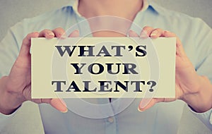 Businesswoman hands holding card sign with what is your talent? question