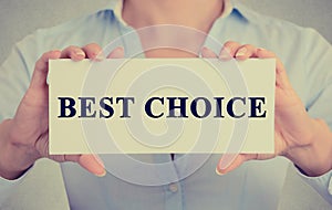 Businesswoman hands holding sign or card with message Best Choice