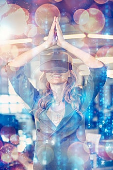 Businesswoman with hands joined using virtual reality simulator