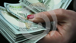 Businesswoman hands recounting american paper currency. Save money concept