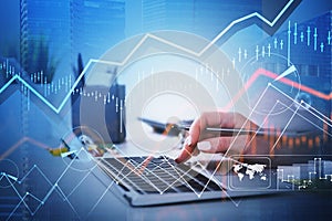 Businesswoman hands or stock trader analyzing stock graph chart by using laptop to buy or sell stock, internet trading concept.