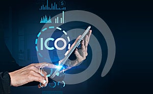 Businesswoman hands with tablet, ICO icon and dark background