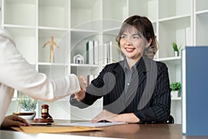 Businesswoman handshake to seal a deal judge female lawyers consultation legal services Consulting in regard to the