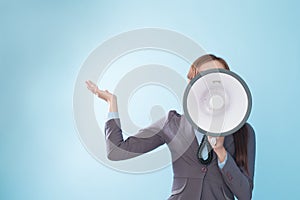 Businesswoman happy with a megaphone