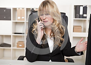 Businesswoman having an argument over the phone
