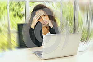 Businesswoman having dizziness, headache, migraine headache due to stressful work photo