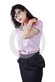 Businesswoman having neck pain