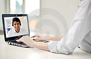 Businesswoman having video call on laptop