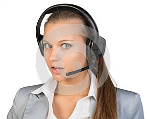 Businesswoman in headset with her head half-turned