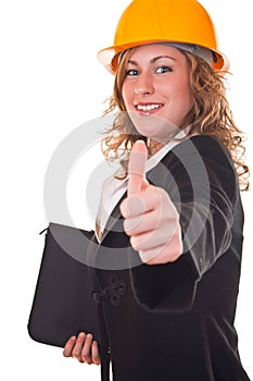 Businesswoman with helmet holding thumb up