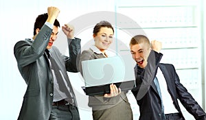 Businesswoman with her collegues using laptop