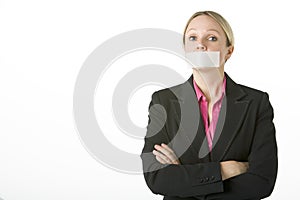 Businesswoman With Her Mouth Taped Shut