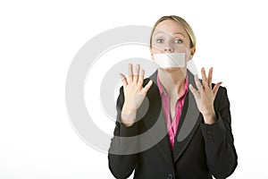 Businesswoman With Her Mouth Taped Shut