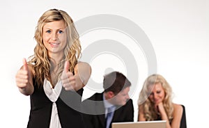 Businesswoman with her thumb up to camera