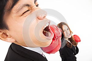 Businesswoman hitting businessman