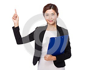 Businesswoman hodling with clipboard and finger point up