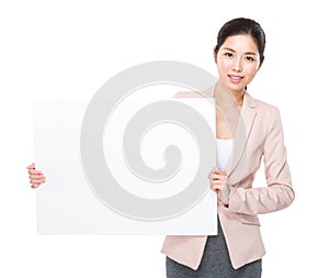 Businesswoman hold with blank placard