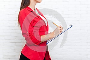 Businesswoman hold folder pencil write wear red jacket