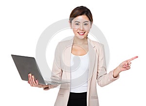 Businesswoman hold with laptop and and finger aside