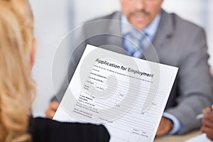 Businesswoman Holding Application Form