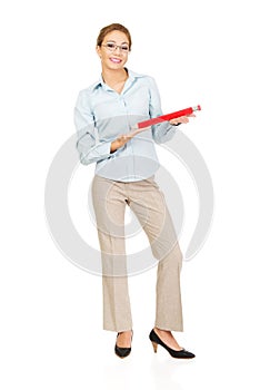 Businesswoman holding big pencil.