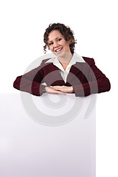 Businesswoman holding a billboard.