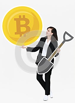 Businesswoman holding bitcoin cryptocurrency and mining concept icons