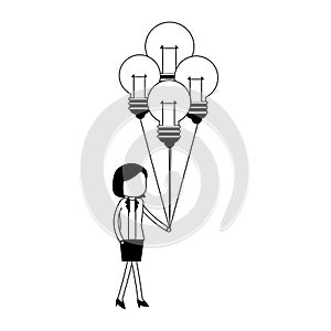 Businesswoman holding bulb light balloons in black and white