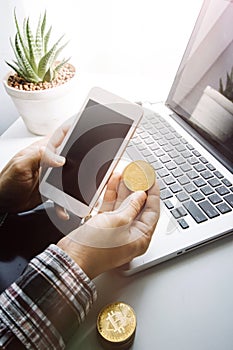 businesswoman holding coins putting in glass with using smartphone and calculator to calculate concept saving money for finance