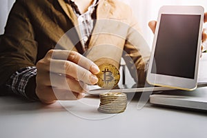 businesswoman holding coins putting in glass with using smartphone and calculator to calculate concept saving money for finance