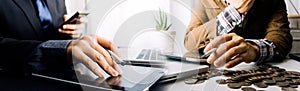 businesswoman holding coins putting in glass with using smartphone and calculator to calculate concept saving money for finance