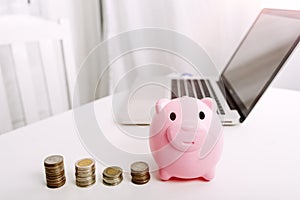 Businesswoman holding coins putting in glass with using smartphone and calculator to calculate concept saving money for finance ac