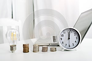 Businesswoman holding coins putting in glass with using smartphone and calculator to calculate concept saving money for finance ac