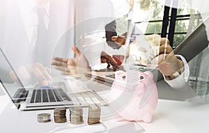 Businesswoman holding coins putting in glass with using smartphone and calculator to calculate concept saving money for finance ac