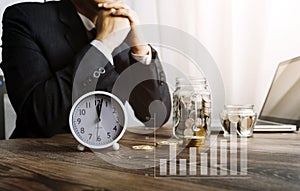 Businesswoman holding coins putting in glass with using smartphone and calculator to calculate concept saving money for finance ac