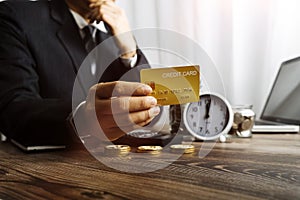 Businesswoman holding coins putting in glass with using smartphone and calculator to calculate concept saving money for finance ac