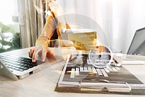 Businesswoman holding coins putting in glass with using smartphone and calculator to calculate concept saving money for finance ac