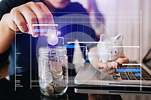 Businesswoman holding coins putting in glass with using smartphone and calculator to calculate  concept saving money and putting