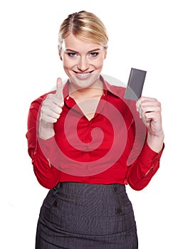 Businesswoman holding credit card.