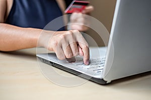 Businesswoman holding credit card for online shopping while making orders via the Internet. business, technology, ecommerce and