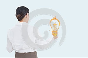 Businesswoman holding a digital light bulb with white background