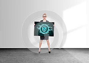 Businesswoman holding digital screen with digital shield with lock hologram