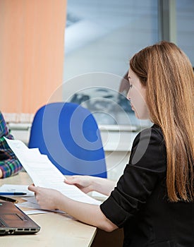 Businesswoman holding documents