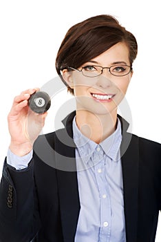 Businesswoman holding eight billiard ball.