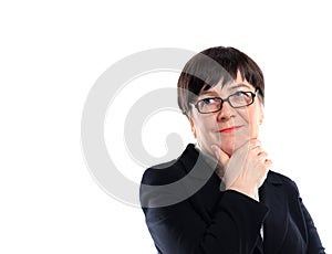 Businesswoman holding glasses and looking sidewards.
