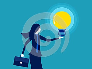 Businesswoman holding a glowing light bulb. knowledge and creativity. business concept