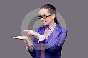 The businesswoman holding hands on gray background