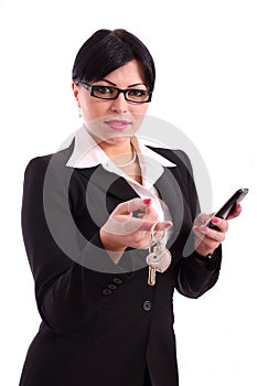 Businesswoman holding keys work and phone