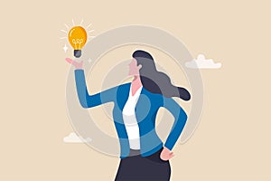 Businesswoman holding lightbulb idea, female or woman leader, solution to solve problem, creativity, imagination or brilliant